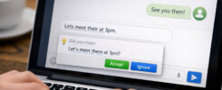 Person typing on laptop displaying TypoGuard correcting a message in a chat application, illustrating real-time writing assistance for clearer communication.